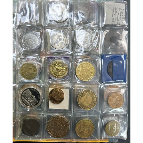 381 - Collection of commemorative medals, coins and tokens in an album, in very mixed condition, mainly 20... 