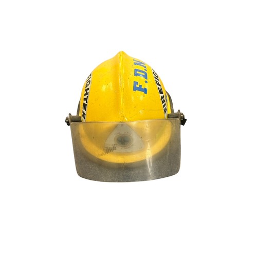 41 - A selection of three Fire Fighting helmets to include; a Cairns & Brother FireFighter Yellow O.W.L V... 