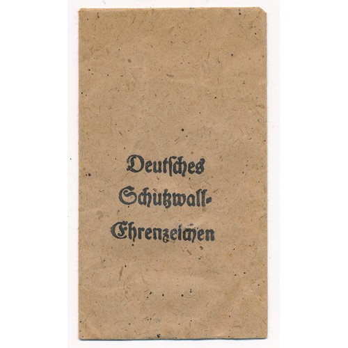 26 - Germany – A German Third Reich West Wall Medal and packet, with ribbon.