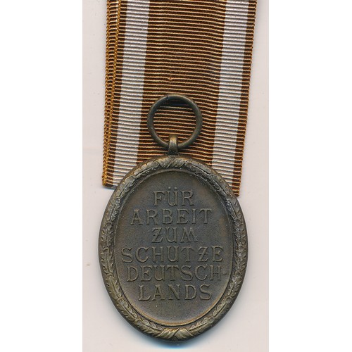 26 - Germany – A German Third Reich West Wall Medal and packet, with ribbon.