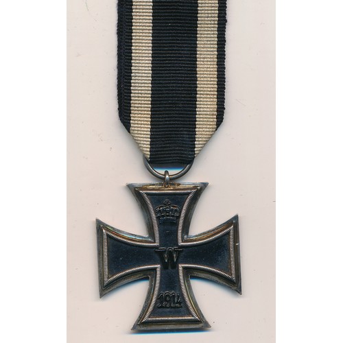 28 - Germany – A First World War German Iron Cross (2nd Class), dated 1914, with ribbon.