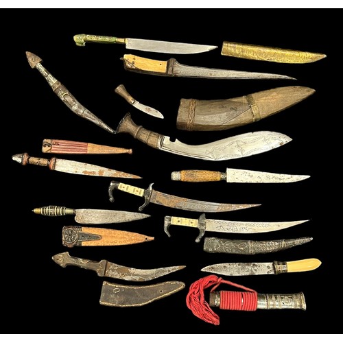 81 - Range of native daggers (11), eight with scabbards, three without, condition is mixed.