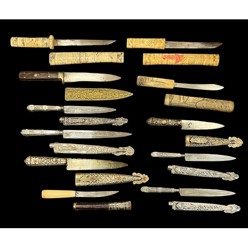 84 - Range of daggers with bone (3) and metal (8) scabbards, several with ornate blades and scabbards. Qt... 