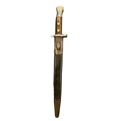 92 - Enfield late 19th century double edged bayonet, with metal mounted leather scabbard, blade stamped w... 