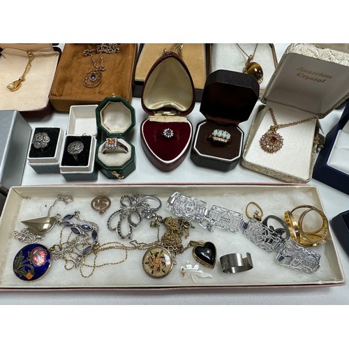 504 - A selection of jewellery including an amethyst pendant stamped 9ct, two 18ct gold plated gemset neck... 