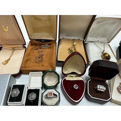 504 - A selection of jewellery including an amethyst pendant stamped 9ct, two 18ct gold plated gemset neck... 