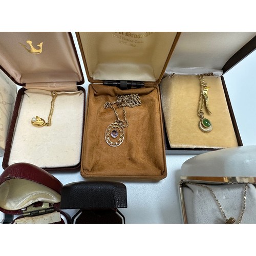 504 - A selection of jewellery including an amethyst pendant stamped 9ct, two 18ct gold plated gemset neck... 