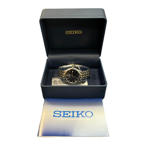 621 - Seiko Quartz wristwatch, steel sapphire crystal, mint with box and papers, spare link included, in w... 