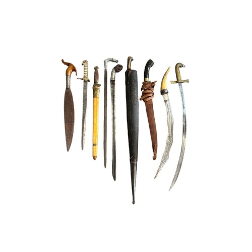 100 - Rage of eight native swords etc, three with scabbards, between 60cm and 90cm total length. Qty 8