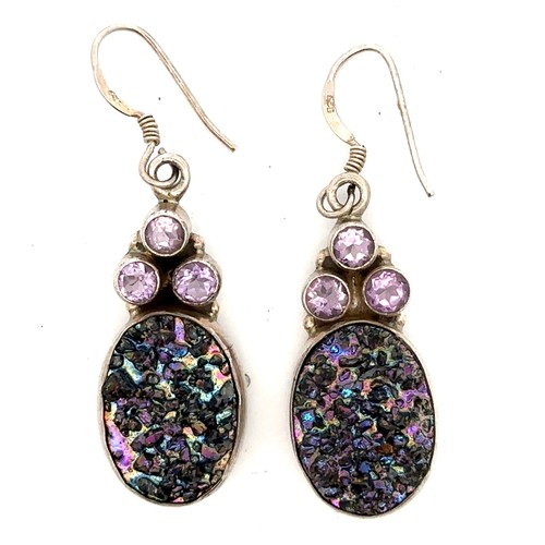 456 - A pair of earrings set with amethysts and stamped 925.