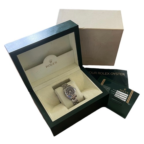 588 - 2009 Rolex Oyster Perpetual wristwatch, steel, rare Black Dial and pinl batons, Original box, bookle... 