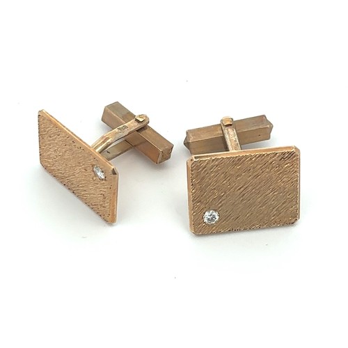 497 - A pair of gold and diamond cufflinks, stamped 375. Diamond weight approx 0.2ct. Total weight approx ... 