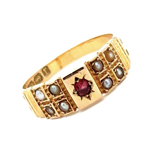 469 - Early 20th century 15ct gold ring set with a central ruby and four seed pearls on each side.  Size L... 