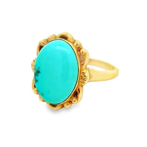 423 - An oval turquoise ring, stamped 10K. Size J. Weight 2.8g approx.