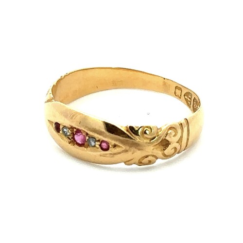 431 - A late Victorian 18ct gold ring with scroll shoulders set with five stones, rubies and diamonds, Che... 