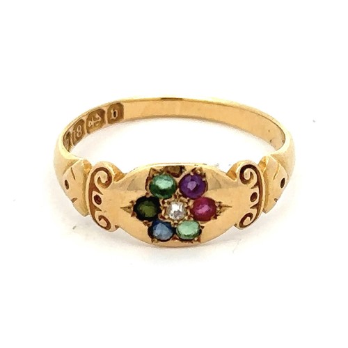 445 - An 18ct gold multi gemstone ring with scroll shoulders, set with diamond, emerald, sapphire, ruby, a... 