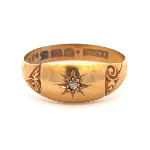 439 - An 18ct gold gypsy ring with a central diamond, approx 0.03ct. Size O. Weight 2.58g approx