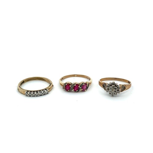 472 - Three 9ct gold rings. Ruby with diamond accents, size T, 7 stone diamond ring size R, diamond cluste... 