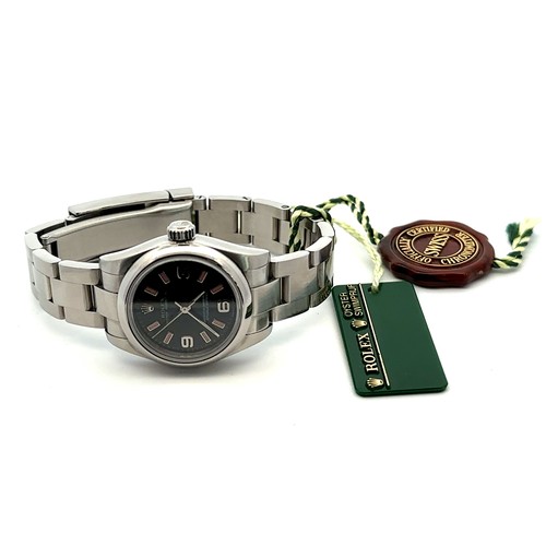 588 - 2009 Rolex Oyster Perpetual wristwatch, steel, rare Black Dial and pinl batons, Original box, bookle... 