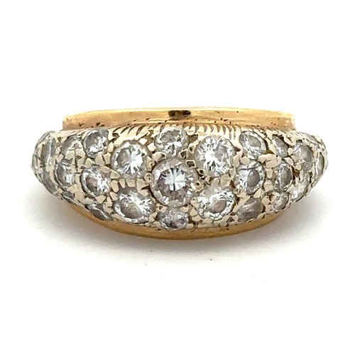 445A - A gold ring set pave with diamonds, the largest of which is approx 02ct and has tiny chip on edge of... 