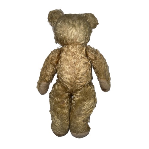 248 - A post-war Chad Valley teddy bear with light curly fur orange and black eyes, jointed limbs and squa... 