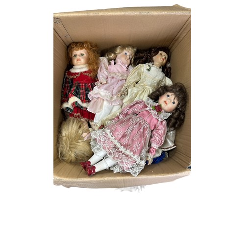 243 - Modern issue unboxed collection of mostly porcelain dolls by Leonardo, many on stands, generally goo... 