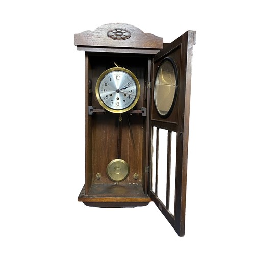 249 - Mahogany cased wall clock with plague 