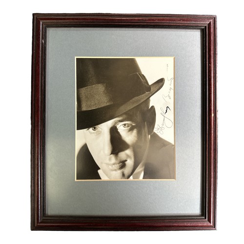 254 - Humphrey Bogart (1899-1957) – A framed black and white photograph signed by Humphrey Bogart in black... 