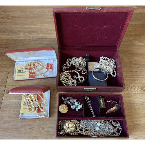 320 - A jewellery box containing silver and costume jewellery including a nephrite pendant.