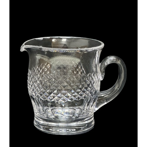 312 - A Waterford Crystal water jug in the Colleen design, height 14.8cm and 10 Lismore design glasses. Th... 