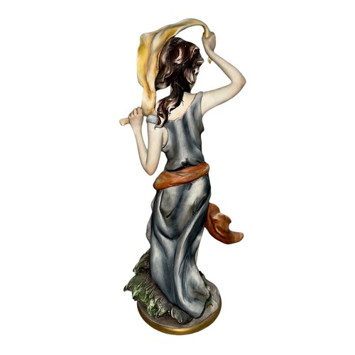 283 - A Joseph Barbetta Capodimonte Italian Flavia figurine of a partially nude woman. Signed ‘Barbetta’ t... 