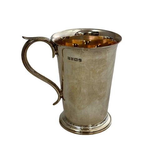 188 - A Barker Ellis tankard with scroll handle. Commemorating the marriage of Charles and Diana and embos... 