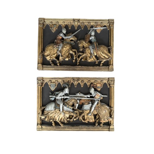 340 - A pair of Marcus Designs hall plaques of jousting/fighting knights, both 22cm by 32cm.