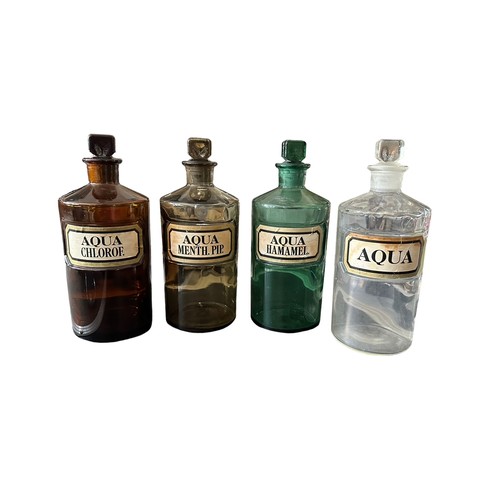 282 - Range of four chemists bottles with ground glass stoppers including clear bottle with 