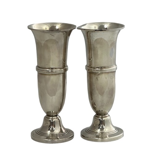 192 - Pair of silver vases  with cylindrical design and band of reeding to the centre body. 13cm high. 197... 