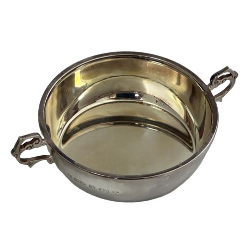 194 - A boxed silver Barker Ellis bowl with twin scroll handles. Diameter 9.5cm, Weight 102g.