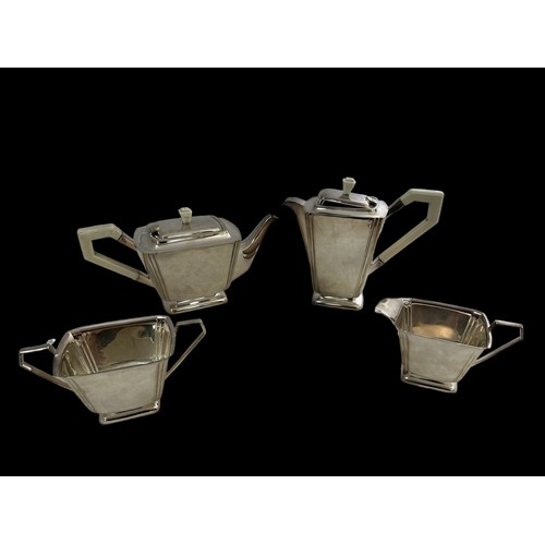 191 - A silver plated Art Deco style four piece tea and coffee service with stylised design. Comprising of... 