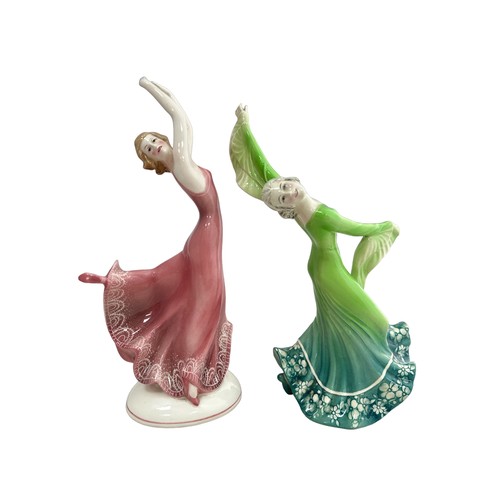 370 - Two Katzhutte porcelain dancing figurines. Dancer in a green dress, 26cm high, small chip on back fo... 