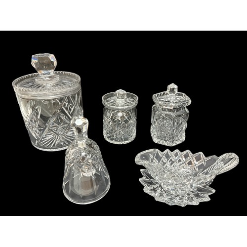 393 - A cut glass biscuit barrel approx 17cm high along with two cut glass jam pots, a crystal bell  and a... 