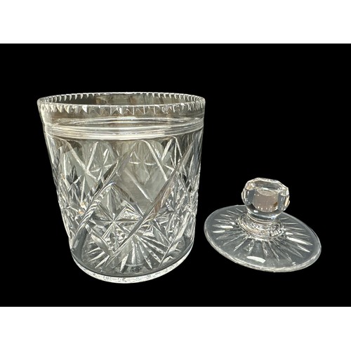 393 - A cut glass biscuit barrel approx 17cm high along with two cut glass jam pots, a crystal bell  and a... 