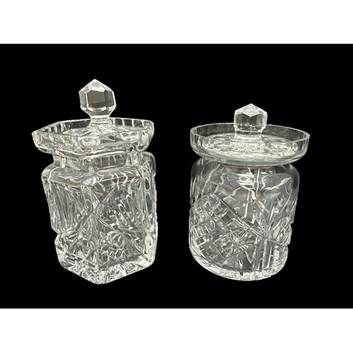 393 - A cut glass biscuit barrel approx 17cm high along with two cut glass jam pots, a crystal bell  and a... 