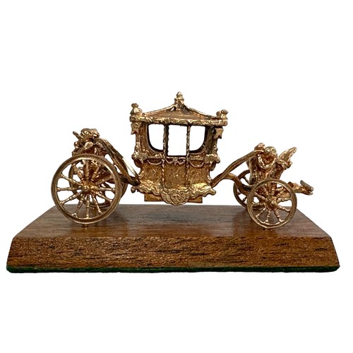 180 - An extremely rare 9ct gold model of the Coronation Coach/ State Coach. Made in 1977 by Toye, Kenning... 