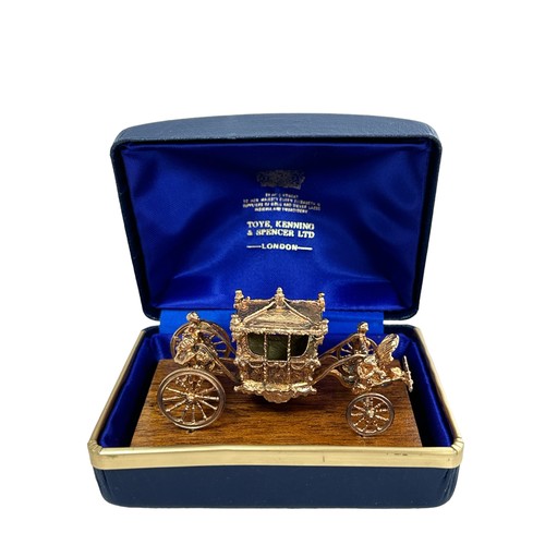 180 - An extremely rare 9ct gold model of the Coronation Coach/ State Coach. Made in 1977 by Toye, Kenning... 