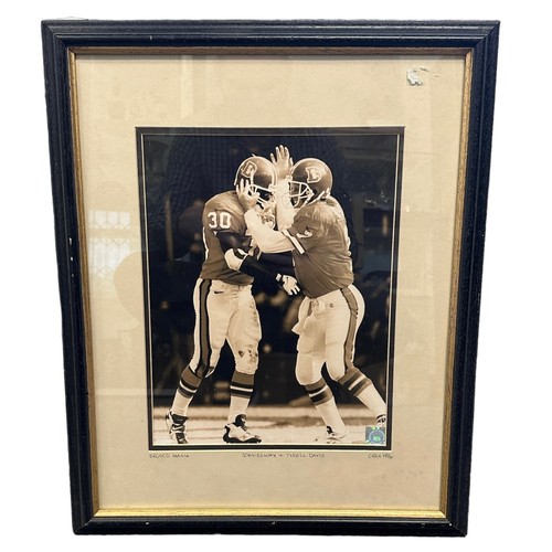 273 - ‘Bronco Mania’ black and white framed photograph of John Elway and Terrell Davis (c.1996) American F... 