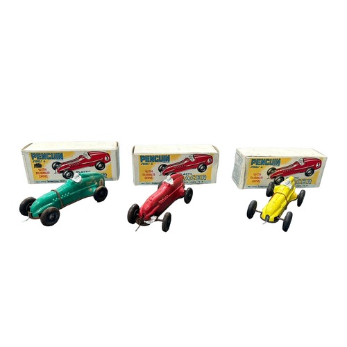 477 - 1950s Trio of Penguin Racer, plastic race car with rubber drive, red, yellow and green examples, gen... 