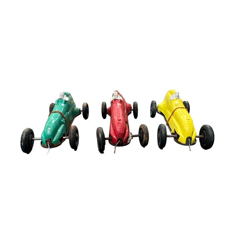 477 - 1950s Trio of Penguin Racer, plastic race car with rubber drive, red, yellow and green examples, gen... 