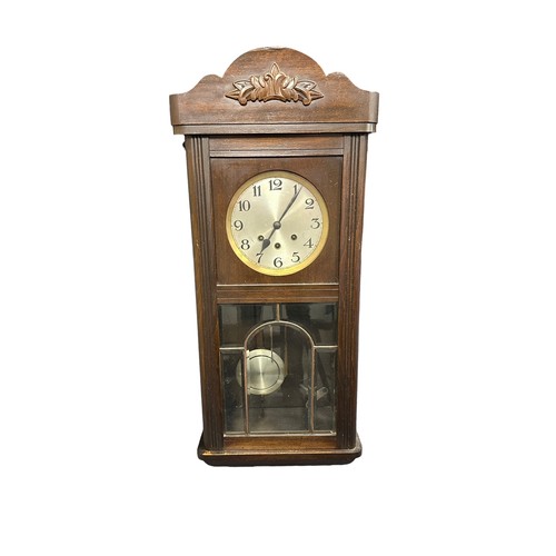 339 - Early 20th Century Mahogany Cased Wall Clock. With pendulum and key. Height 77cm Width 32cm.