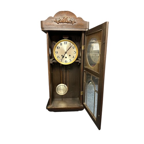 339 - Early 20th Century Mahogany Cased Wall Clock. With pendulum and key. Height 77cm Width 32cm.