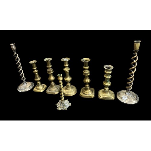 295 - Small selection of brass candle sticks, to include; pair of barley twist height 35cm (2), smaller ba... 