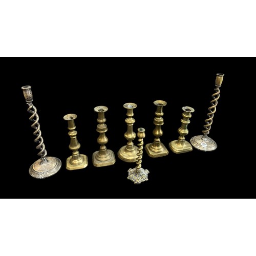 295 - Small selection of brass candle sticks, to include; pair of barley twist height 35cm (2), smaller ba... 